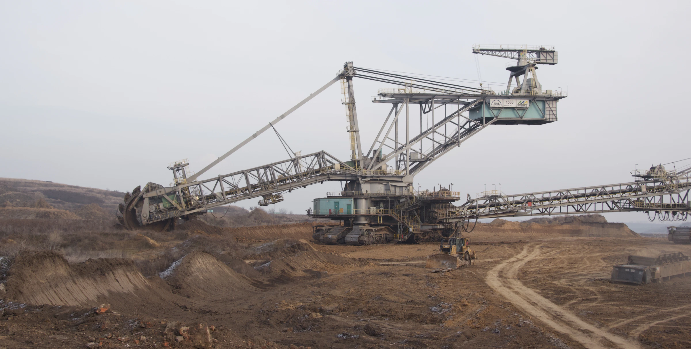 Excavator at an active open-pit mining site